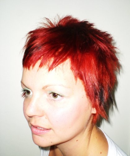 funky choppy pixie cut bright red with black chunky low lights