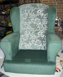 Wing arm chair with legs off before reupholstery