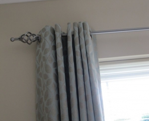Custom made Eyelets on Cameron Fuller metal pole with Cage finials