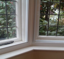 Close up of secondary glazing fitted in a bay window