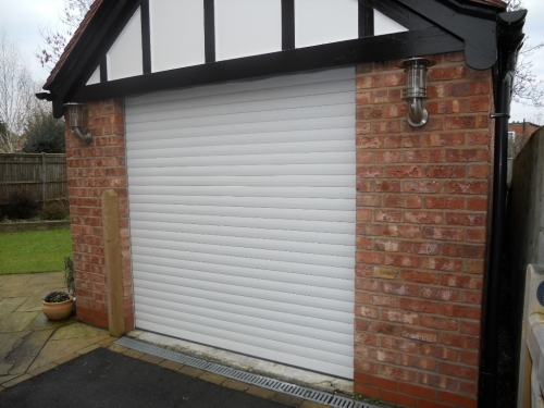 QSec Insulated Roller Garage Door. Remote control operation with safety edge.