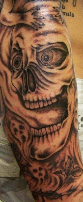 West Coast Tattoos' Black & Grey work by Blan. Skull, smoke and demon sleeve.